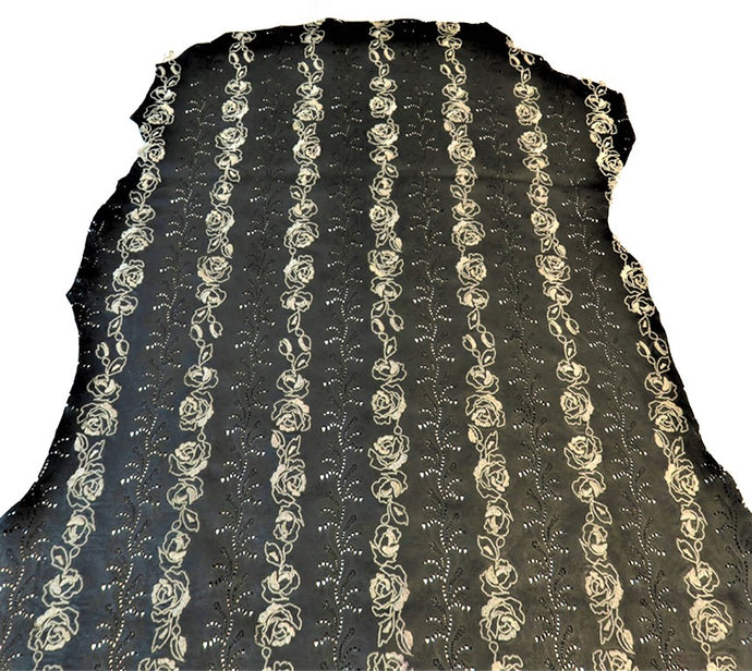 Pelle nera traforata e ricamata